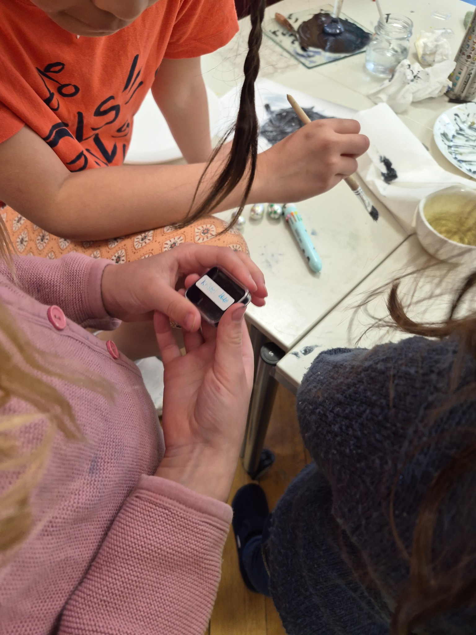 Children painting with handmade ink