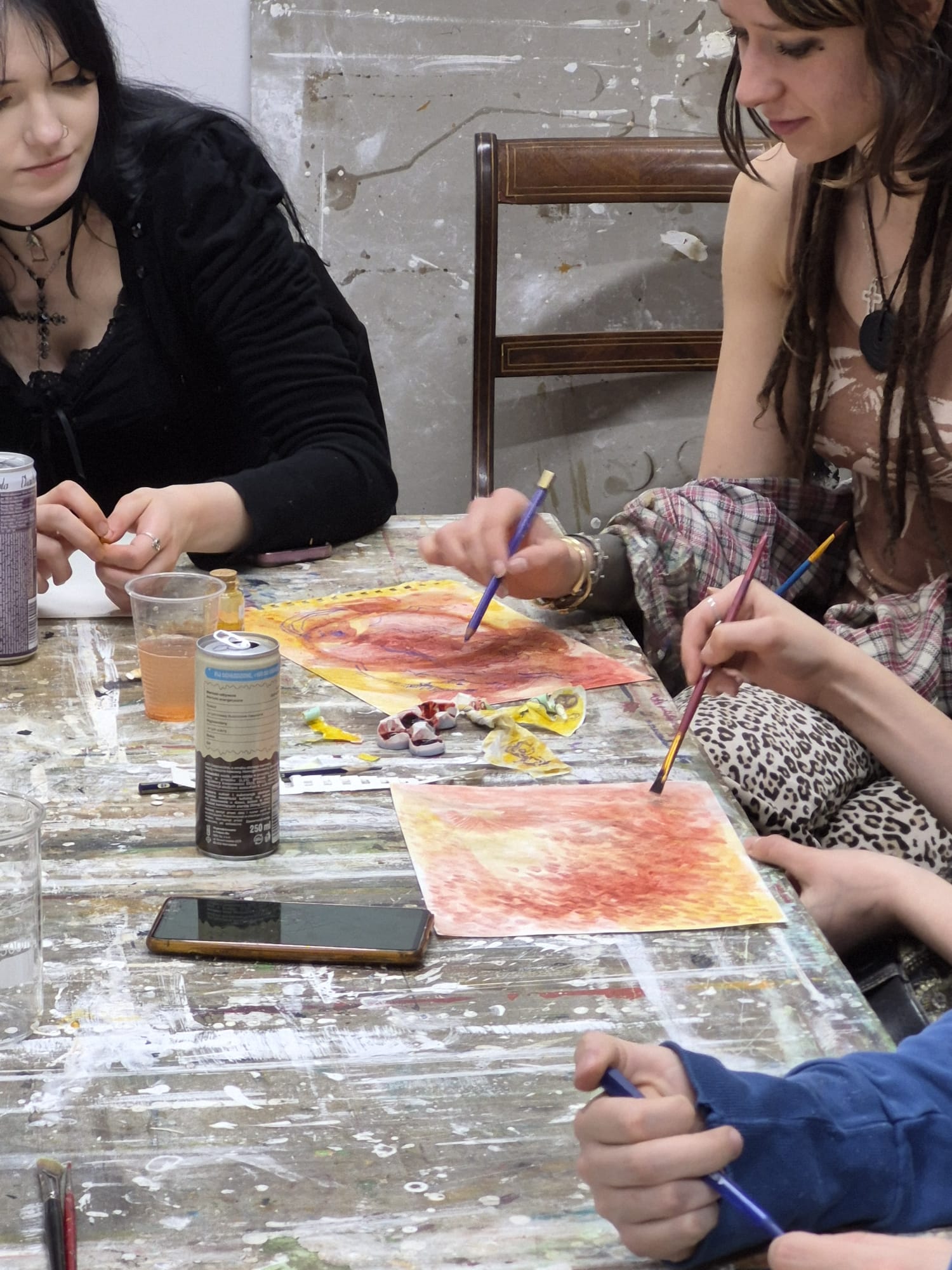 Participants painting together with handmade pigments