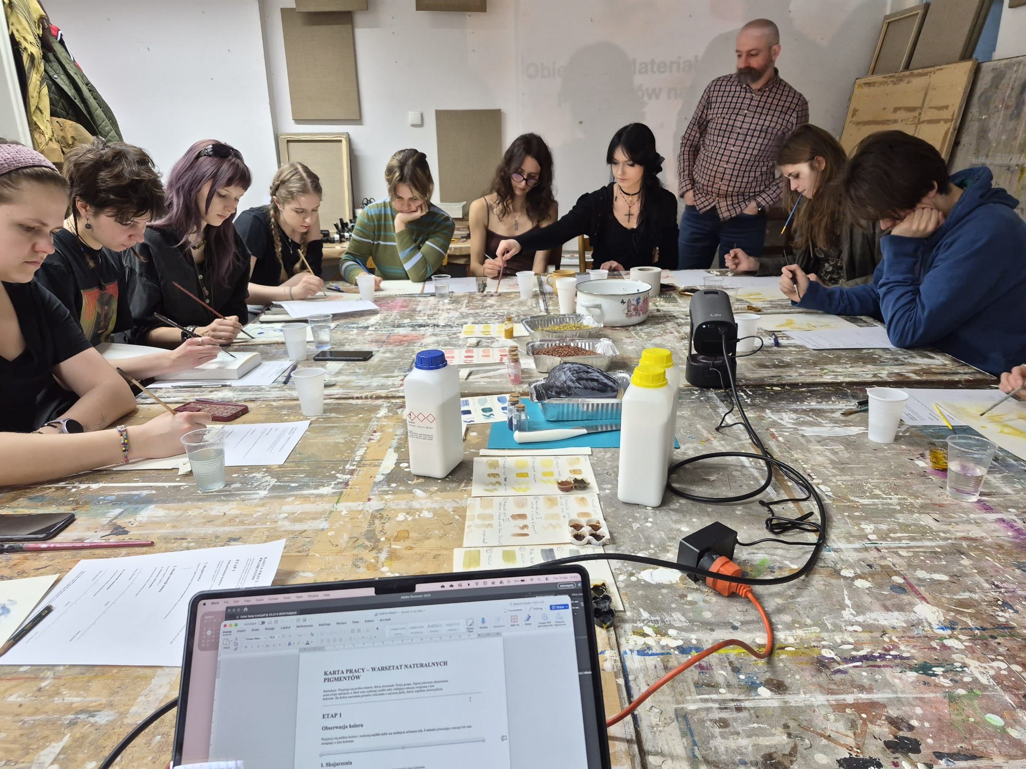 Participants painting with natural pigments during a workshop